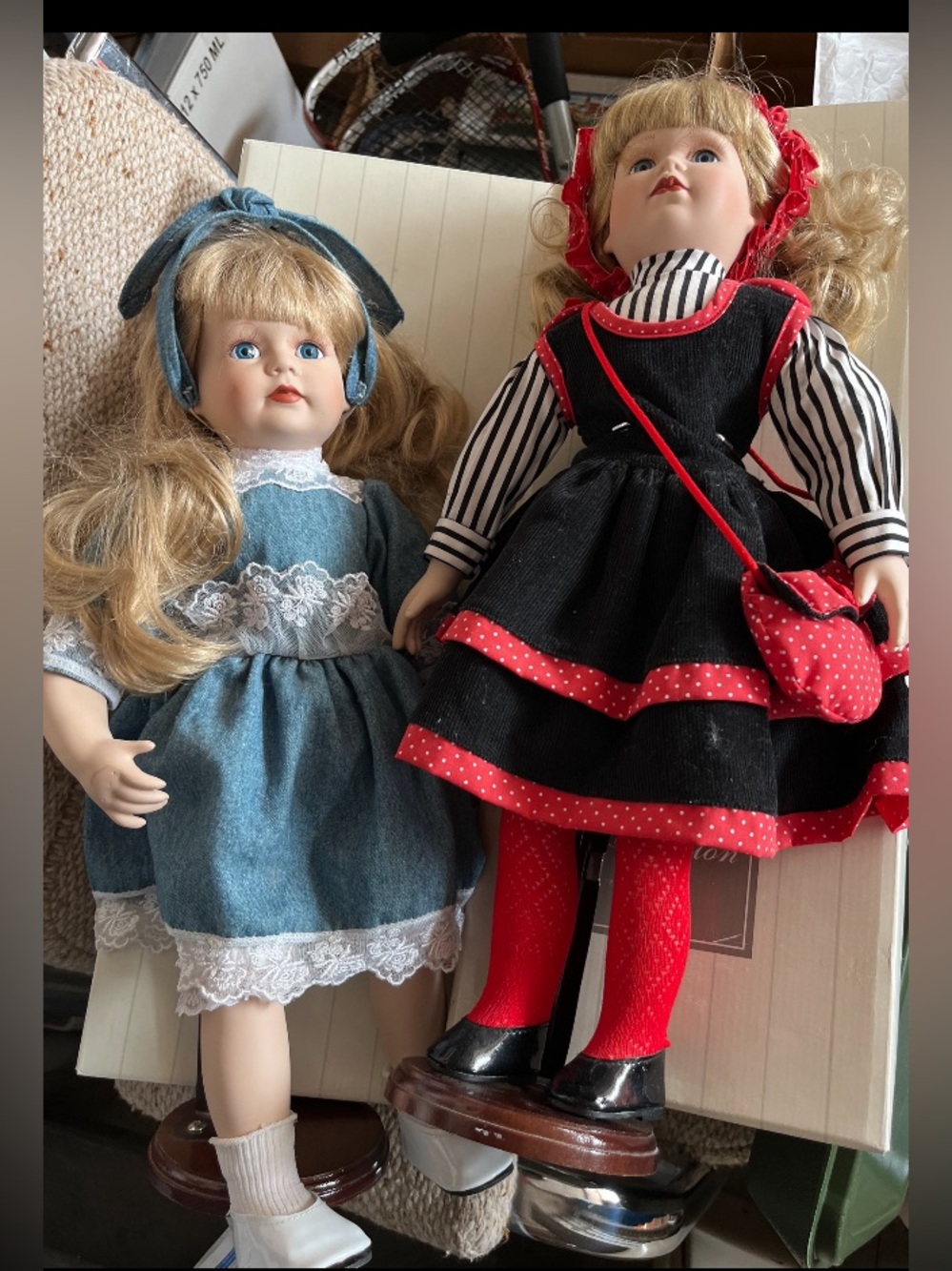 Two Collectible Dolls - Blue Dress & Black/Red Outfit